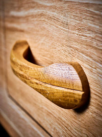 Carved wooden-effect handle detail