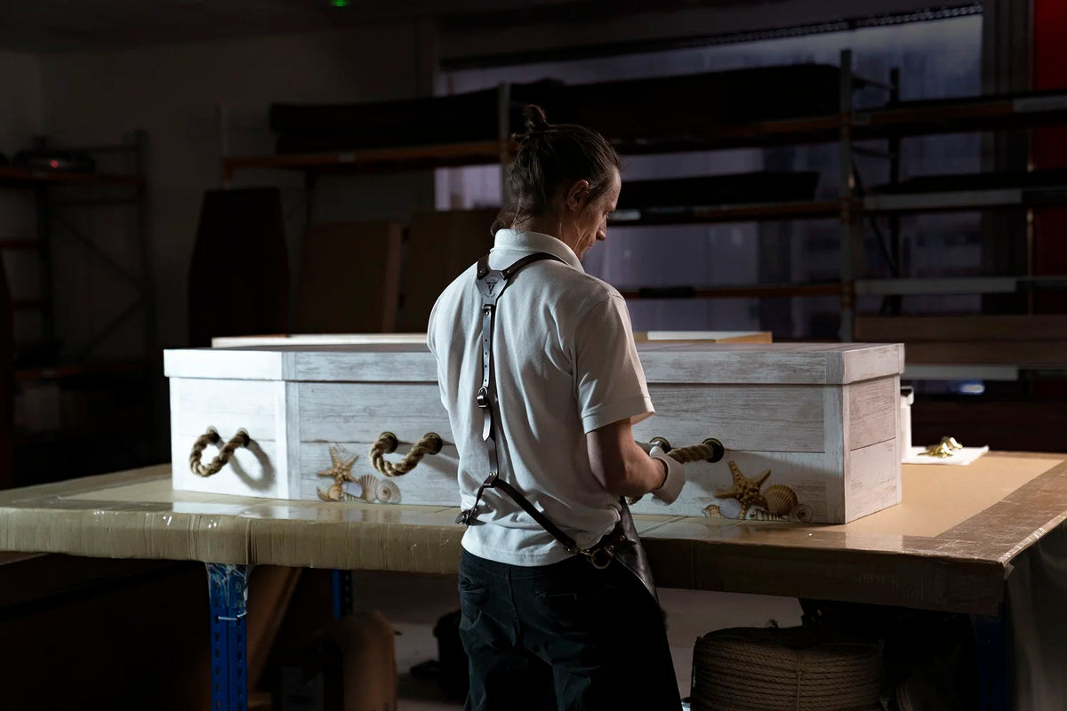 Craftsman finishing a coffin in the Parley Green workshop